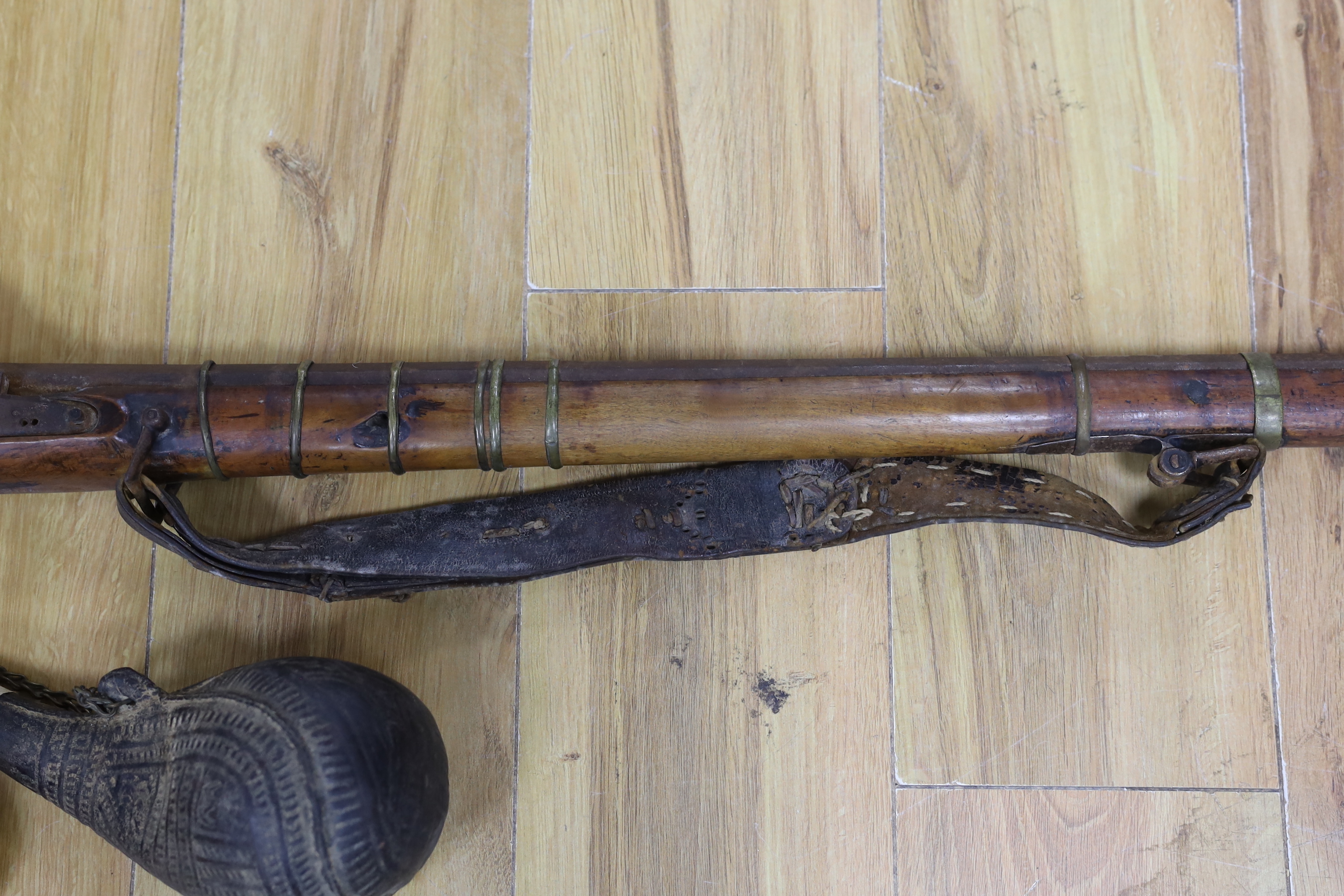 An Afghan percussion rifle and two shot flasks, rifle 143cm